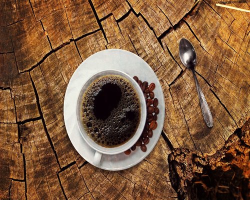 A cup of coffee on a wooden table