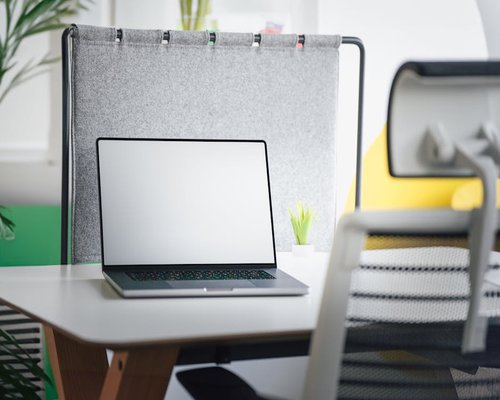 Empty office chair and desk showing a break time